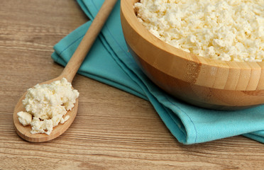 cottage cheese in bowl on  wooden table