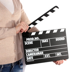 Movie production clapper board in hands isolated on white