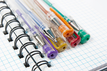 Colorfull pens and a notebook
