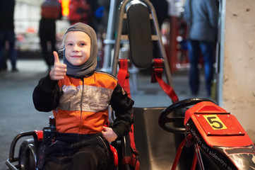 Happy little girl on karting