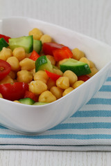 Chick peas salad with red peppers, cherry tomatoes and cucumber