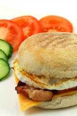 English muffin with bacon, egg and Cheddar cheese