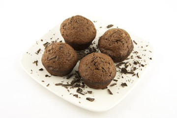 chocolate muffins on a white plate