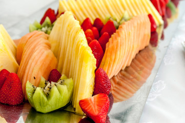 greedy and colored cut fresh fruit