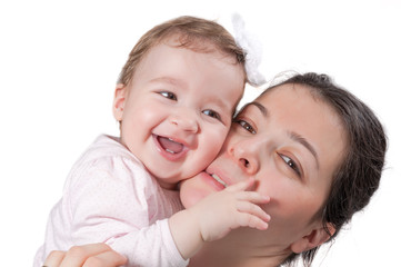 Isolated happy baby girl and mother smiling on white background