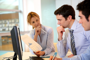 Business team working in front of desktop