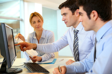 Business team working in front of desktop