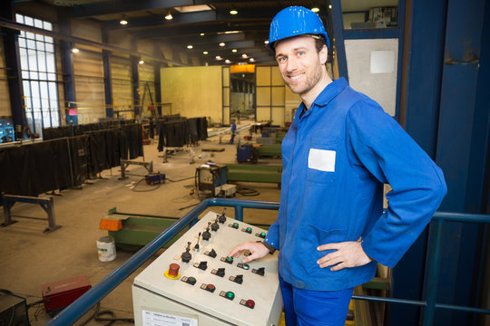 Construction worker operating a machine