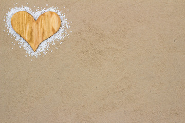 Wood Heart in the sand.