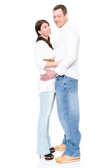 Young and happy couple in front of white background