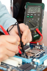 Technician repairing computer hardware