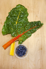 Chard and dish of blueberries.