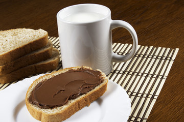 bread with chocolate and a glass of milk