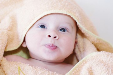The funny baby in an orange blanket (4 months)