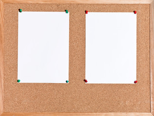 white sheets of paper on cork board