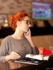 Businesswoman on a coffee break, using tablet computer 