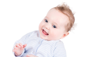 Portrait of a beautiful baby girl in a blue sweater