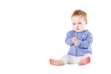 Beautiful baby girl wearing a purple sweater