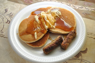 Delicious Pancakes with Syrup and Sausages