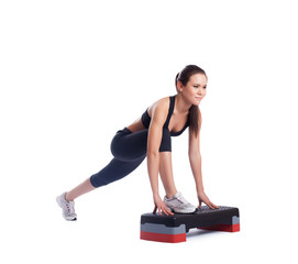 Pretty brunette woman with stepper