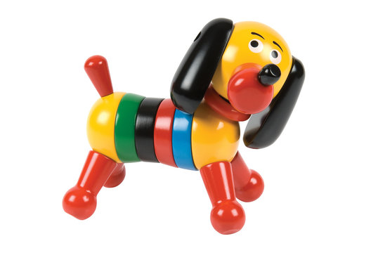 Wooden toy dog on a white background. Clipping path included.