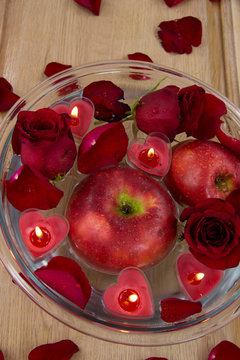 Valentine apple witn candles and rose petals