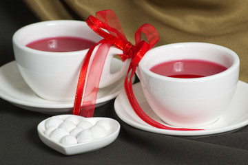 Fototapeta na wymiar Two china cups of hibiscus tea