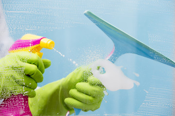 Cleaning - cleaning window pane with spray detergent