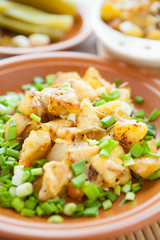 fried potatoes with cheese crust, chives