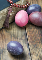 Obraz na płótnie Canvas dyed Easter eggs and religious Christian symbols
