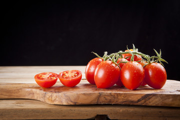 fresh ripe cherry tomato on wooden table