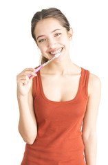 Attractive young woman holding toothbrush