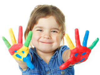 Cute little girl is proud of her coloured hands