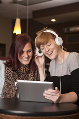 Young Women Listening To Music