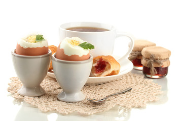 Light breakfast with boiled eggs and coffee, isolated on white