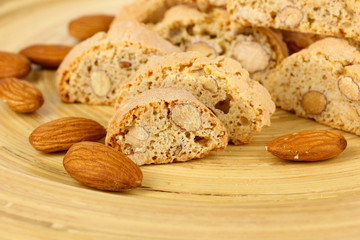 Aromatic cookies cantuccini on wooden plate close-up