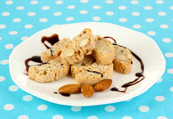 Aromatic cookies cantuccini on plate on blue tablecloth