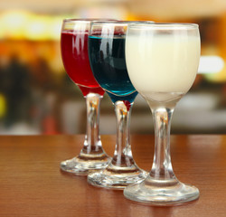 Tasty color liquors, on bright background
