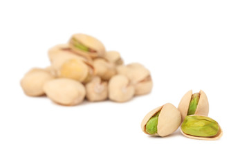 Two stacks of pistachios (isolated)