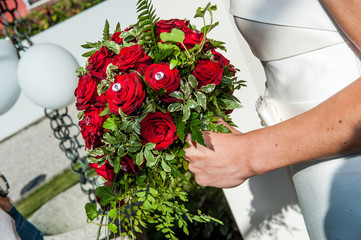 wedding bouquet with bride arm