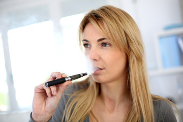 Woman smoking with electronic cigarette