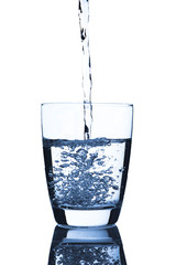 Water pour into glass of water
