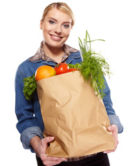 Young woman with a grocery shopping bag. Isolated on white backg