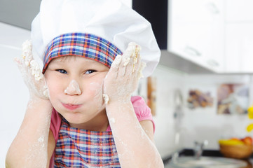 Funny little baker grimaces