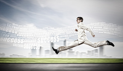 Businessman running on the road