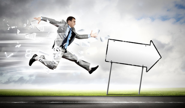 Businessman running on the road