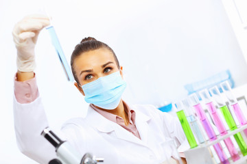 Young female scientist working in laboratory