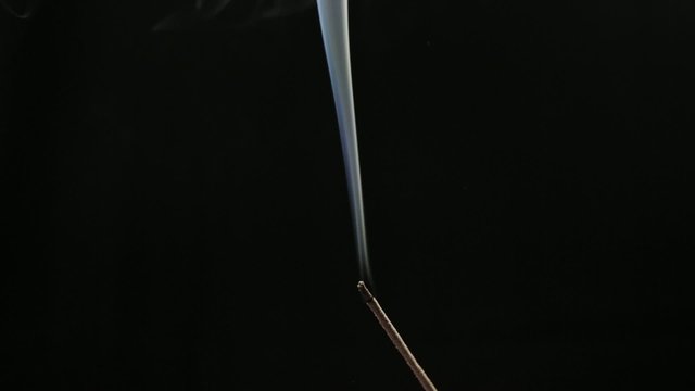 incense smoke over dark background