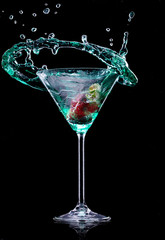 Martini drink over dark background