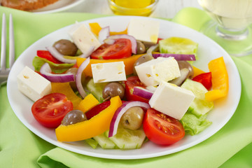 salad with olives and cheese on the plate